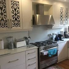 Two swivel dining chairs feature aluminum frames with hand woven resin wicker chair backs. Royal Kitchens Amanzimtoti Home Facebook