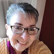 This cute 7 pounder throws up in the car after 15 minutes. I don't feed her  , give her half a dramamine and have her in a booster seat. Suggestions?