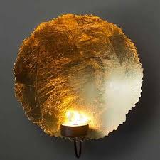 It includes two sconces, all crafted from iron in a classic black finish. Alexander Candle Holder Wall Sconce