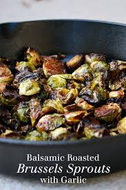 Place the butter and oil into a wide frying pan over a medium heat. Balsamic Roasted Brussels Sprouts With Garlic The Live In Kitchen