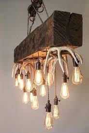 23 Diy Decoration Ideas Using Antler Choice Is Endless Diy Chandelier Antler Lights Rustic Chandelier
