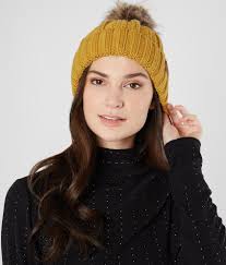 They're tight knit, with a longer body and cuffed hem. C C Cable Knit Beanie Women S Hats In Mustard Buckle
