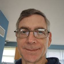 What could be causing the hop and vibration in a UH-1 Huey Helicopter  during lift?