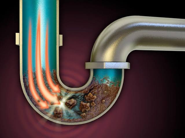 Debris accumulation inside a standard P-trap, AI generated