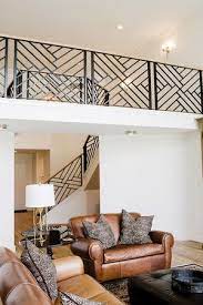 That combination revives the passage into the second floor with a soft and living look. Modern Iron Staircase And Railing Loft Above Living Room Simple Living Room Staircase Design Loft Railing