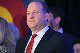 Colorado governor pledges to end chartered migrant buses bound for Chicago,  New York