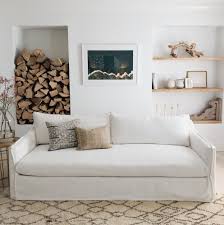 (via style court) lately i've been stopped in my tracks every time i spot a good use of the timeless, classic camelback sofa. The Slipcover Sofa Trend Is The Most Unexpected Revival Of 2019