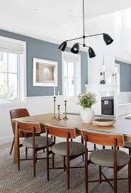 Marigot large chandelier over glossy black dining table. Mid Century Modern Chairs At Oak Dining Table Transitional Dining Room