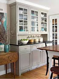 A dining room in white of mismatched chairs, floral walls and plate decors. Follow The Yellow Brick Home Dreamy Kitchen Built Ins Butler S Pantries China Cabinets And Hutches Follow The Yellow Brick Home