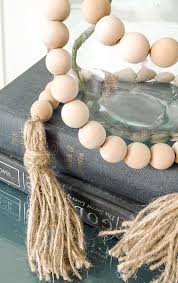 5 Diy How To Make A Wood Bead Garland With Tassels Wood Bead Garland Beaded Garland Wooden Bead Garland