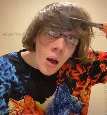 Chris cutting his hair