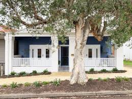 Is cladding cheaper than render? Navy Weatherboard House A Crazy Good Before After The Interiors Addict