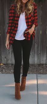 Woman Black Jeans And Brown Boots Woman On The Sidewalk Wearing Black Skinny Jeans White T Shirt Plaid Shirt And Brown Boots Autumn Fashion Women Fashion Fall Fashion Trends