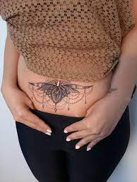 Pretty women show beautiful butterfly and tribal tattoo. 150 Stomach Tattoos That Will Help Make A Bold Style Statement Wild Tattoo Art