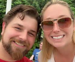 Can someone please remove the boy and put the two girls together. Please  also make the cardigans the same shade of blue. Thank you.