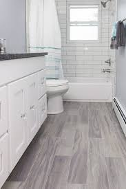 The deep hue ties together the plaid floor tiles, bead board, and printed wallpaper. Bathroom Floor Tile Ideas For Small Bathrooms Design Corral
