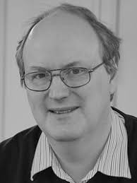 Ultra Thin Films of Yttrium Iron Garnet with Very Low Damping: A Review