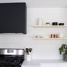 Vertical Offset Subway Tile With Black Hood Vent And Floating Shelves Kitchen Splashback Tiles White Kitchen Tiles Kitchen Splashback