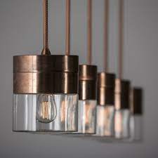 This three light pendant fixture is great for highlighting key parts of your home, like a dining table or kitchen island, and the dimmable lights allow you to control the lighting mood on any day. Chapeau Satin Copper Hanging Light Fixture Toscot In 2021 Copper Hanging Lights Hanging Light Fixtures Kitchen Lighting Fixtures