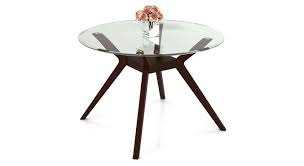 A rectangle table with pull outs to make it bigger. Wesley 4 Seater Round Glass Top Dining Table Urban Ladder