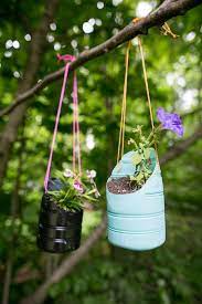 For instance, cut the twine about 12 feet long to hang the vertical garden. Diy Hanging Planters Made From Recycled Bottles Diy Hanging Planter Diy Plastic Bottle Plastic Bottle Hanging Planter