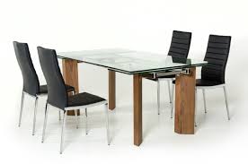 The contrasting black upholstered chairs provide just the right look. Vig Helena Extendable Glass Dining Table
