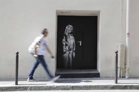 Banksy originally comes from bristol and in the beginning he became known there and in london for his template graffiti works on walls of houses in public space. Anonymous Graffiti Artist Banksy Opens New Online Shop Art Culture The Jakarta Post