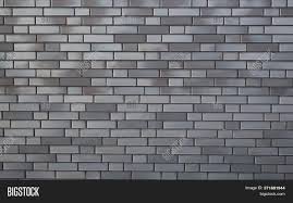 Enjoy free shipping on most stuff, even big the combination of deep charcoal and steel gray colors creates a depth and atmosphere to this 33' l x 20.5 w metallic wallpaper roll this natural exquisite brick pattern gives a kind of visual illusion. Gray Brick Wall Image Photo Free Trial Bigstock