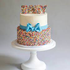 Buttercream And Rainbow Sprinkles With Blue Bow Baby Shower Cake Blue Lace Cakes Baby Shower Cakes Baby Birthday Cakes Baby Shower Cakes Girl