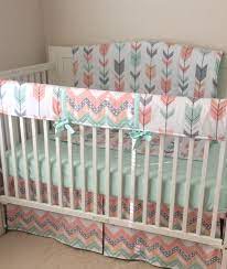 A peach and mint nursery featuring a peach and gold triangle decal accent wall. 97 Best Coral Peach Mint Nursery Ideas Mint Nursery Nursery Girl Nursery