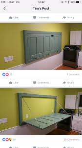 Folding Table Made Out Of Old Wooden Door Hung On The Wall Room Storage Diy Laundry Room Storage Shelves Old Wooden Doors