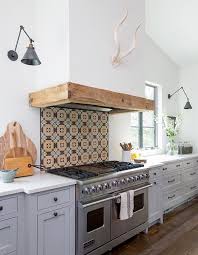 Need a removable backsplash solution that can handle nasty food splatters? 2 White Wood Rooms Tile Backsplash Behind Stove And Antlers House Home