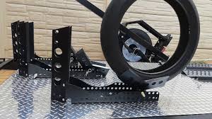 Over 100 retail stores · family owned + operated 38 Motorcycle Wheel Chock Tow