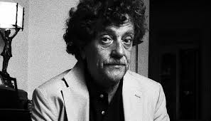Kurt Vonnegut (1922–2007) was an iconic American writer, known for his  satirical voice, dark humor, and humanist beliefs. His works often explore  themes of free will, the absurdity of war, and the