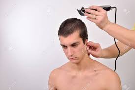 Hair cut numbers are different lengths of men hair that are very short hair, little longer cut, side the #2 haircut is not too long or short and is ¼ of an inch in clipper size. Young Man Having A Haircut With A Hair Clippers Over Stock Photo Picture And Royalty Free Image Image 46209635