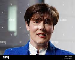 Education Minister Norma Foley (centre) with caricature artist Ken Coogan  (left) and Daniel McNally, 4th year student at St. Patrick's Grammar  School, at the Department of Education, Dublin, during the launch of