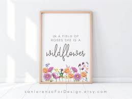 Id be happy to change font or colors too. In A Field Of Roses She Is A Wildflower Print Lilac Nursery Etsy In 2021 Lilac Nursery Photo Frame Display Girl Nursery