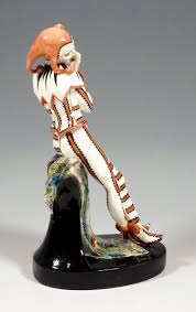 A white cat snuggles up his legs. Art Deco Figure Harlequin With Flute By Josef Kostial Goldscheider Vienna For Sale At 1stdibs