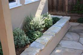 Stucco Seating Wall With South Bay Quartzite Cap Concrete Patio Designs Mediterranean Garden Design Garden Wall