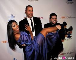 Yellow plunging dress & mask. Sheknows Com Campaign Launch Benefitting Autism Speaks