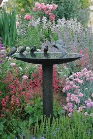 20 Beautiful Garden Decorations Sculptures To Accentuate Garden Design Beautiful Gardens Garden Decor Bird Bath