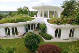 New luxury home with elegant touches including covered entrance, columns. Green Roof Inspiration Insteading