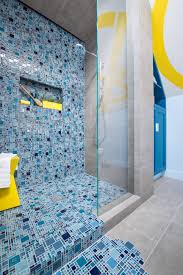 The tiles we provide use o Blue Mosaic Tile Spills From Shower Onto Floor To Create Pooling Effect Hgtv