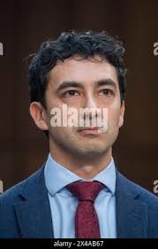 University of Miami Rosenstiel School of Marine, Atmospheric, and Earth  Science senior research associate Dalton Hesley swims out with supplies,  Friday, Aug. 4, 2023,