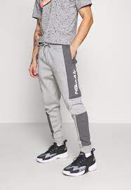 Nike Sportswear M NSW NIKE AIR PANT FLC - Pantalones deportivos - dark grey  heather/charcoal heather/white/gris oscuro - Zalando.es