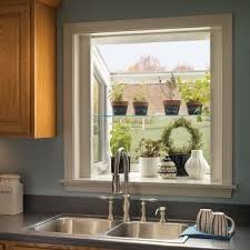 To make your space feel brighter and even more inviting, consider kitchen window design ideas such as white picture windows over the kitchen sink. Garden Window Above Kitchen Sink