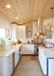 French Country Kitchen With Natural Wood Plank Ceiling Concrete Kitchen Floor Kitchen Flooring Wood Plank Ceiling