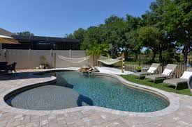 Pool With Sand And Hammock Swimming Pool Builder Pool Builders Swimming Pools Inground