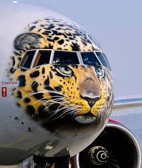 Rossiya Airlines Boeing 777300 With A Face Of The Endangered Amur Leopard Painted On Its Nose Cone Arrives At Vladivosto Airplane Art Aircraft Art Aviation Art
