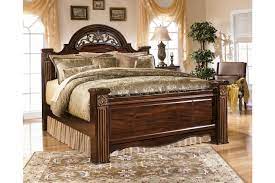 Richly finished beads, carvings and rope details; Gabriela King Poster Bed Ashley Furniture Homestore